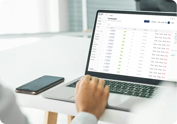 Engineer reviewing system data on a laptop during deployment in a production environment